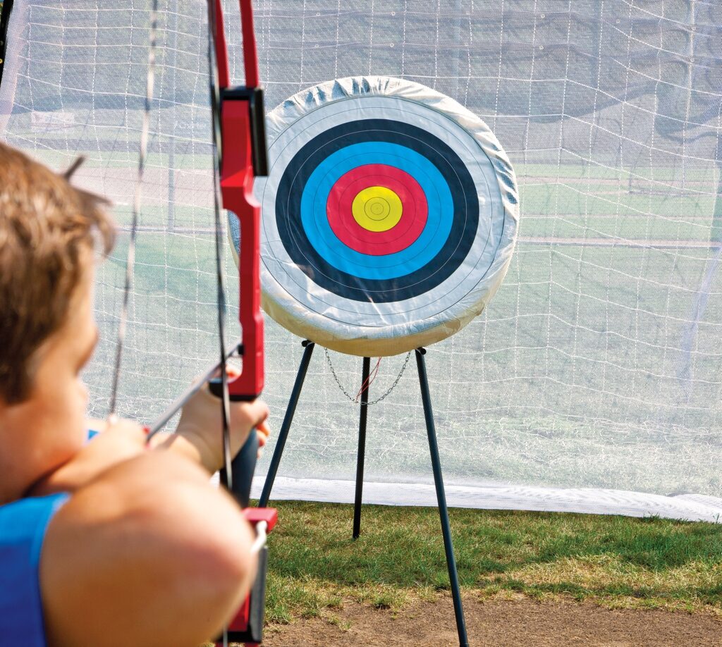 Archery backstop netting set up for physical education target game activities